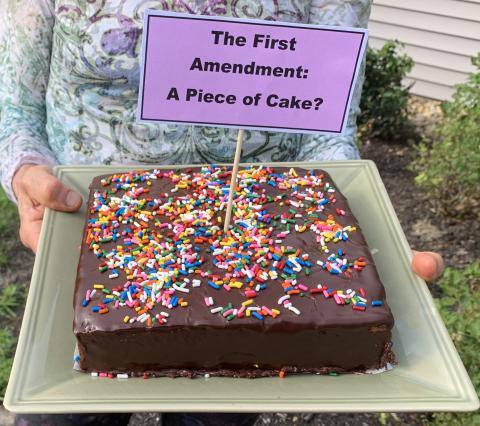 Cake with sign reading "The First Amendment: A Piece of Cake?"
