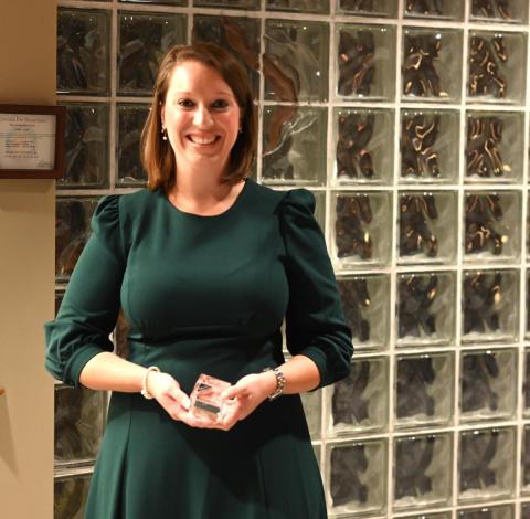 Lyndsay Robinson holding Friedman Award